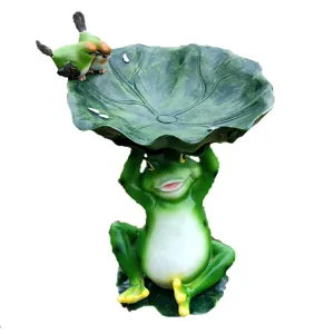 Detailed view of cute resin frog holding lotus leaf bird feeder, perfect garden ornament.
