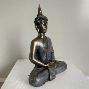 Detailed side view of Thai Shakyamuni Buddha statue resin craft tabletop ornament.