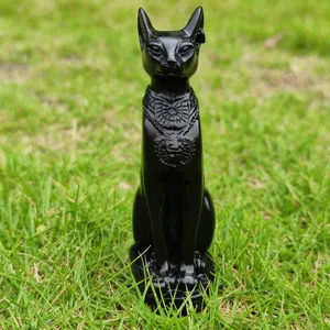 Close-up detail of black resin Bastet cat statue ornament, exquisite carved pattern.