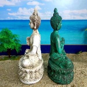 Detailed view of Thai Shakyamuni Buddha resin statues with vintage finish and lotus base.