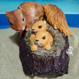 Resin squirrel figurine detail shot, cute animal family sculpture for garden and home decor.
