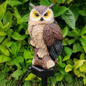 Solar owl garden light detail view, resin animal stake lighting for lawn yard outdoor decoration.