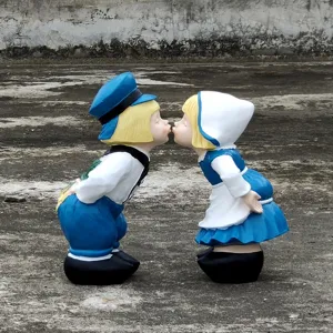 Detail view of European kissing children garden statue, resin couple ornament for yard decor.