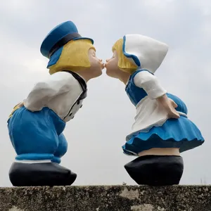 Close-up detail of the romantic couple garden statue, featuring a kissing design for outdoor yard decor.