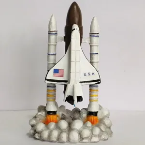 Close-up detail of space shuttle model ornament with smoke base, fine hand-painted texture.