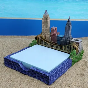 Close-up detail of the resin New York architecture memo pad and pen holder desktop decor.