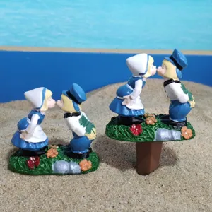 Close up detail of the resin kissing couple garden figurines, showcasing fine crafts details.