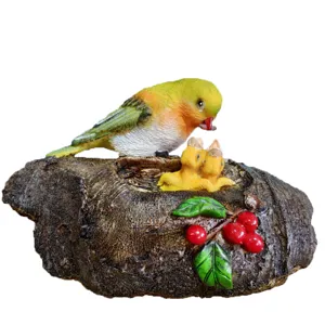 Resin bird feeding nest sculpture garden ornament detailed view for outdoor yard plant decor