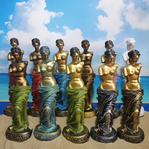 Detailed view of colorful Aphrodite Venus resin statues displayed on sand for chic home decor.