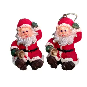 Detailed view of cute resin Santa Claus figurine and hanging ornament for Christmas decor.