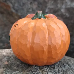 Resin carved pumpkin ornament with detailed texture, perfect for Halloween festival decor.
