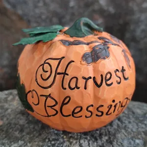 Resin pumpkin ornament detail, Harvest Blessings engraved autumn decor piece for tabletop.