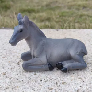 Resin donkey figurine detail shot, realistic grey animal craft ornament for decor.