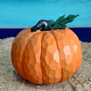 Resin pumpkin decoration ornament for Halloween harvest festival and sand tray accessory display.