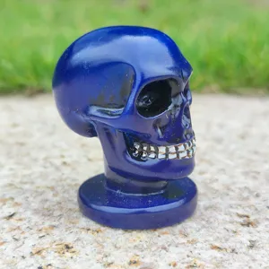 Blue skull figurine detail view, resin skull ornament for Halloween decor or sandbox props.