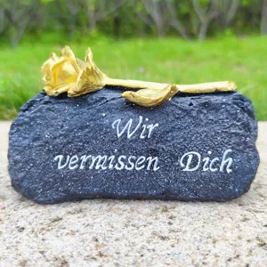 Memorial grave stone prop with gold rose decoration and engraved text for outdoor garden decor.