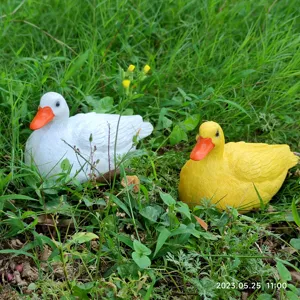 Cute resin duck figurines set, yellow and white small animal ornaments for garden decor.