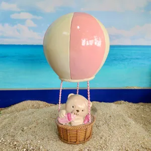 Mini resin hot air balloon bear figurine, cute sand tray toy accessory for kids play and home decor.