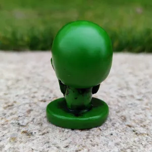 Green skull figurine miniature horror Halloween sandbox prop toy detail shot decoration
