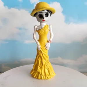 Halloween resin skeleton figurine decoration with yellow dress for holiday party decor.