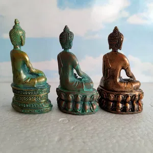 Detailed view of three miniature bronze Buddha statues, perfect for sandbox and home decor.