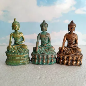 Miniature sitting Buddha figurines set, antique bronze patina finish, ideal for meditation decor.