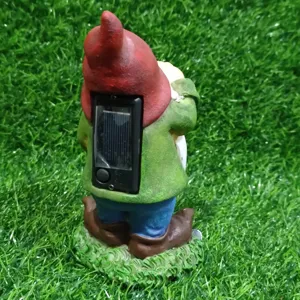 Solar garden gnome resin figurine back detail showing solar panel and switch for outdoor decor.