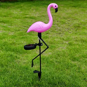 Solar powered pink flamingo garden light outdoor lawn landscape decor detail close up view