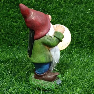 Solar garden gnome statue with glowing glass ball, resin outdoor light decor for yard.