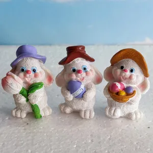 Set di statuine in resina di coniglietto pasquale, simpatici conigli con uova per decorazione.