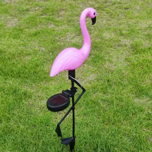 Outdoor solar flamingo garden stake light detail showing pink bird ornament and solar panel.