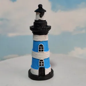 Detailed view of the miniature Mediterranean lighthouse resin ornament for fish tank decor.