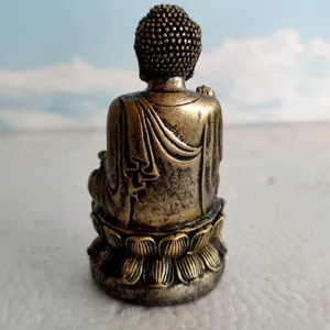 Mini bronze Buddha figurine back view, resin sculpture detail for sand tray zen decor.