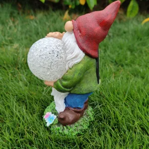 Solar garden gnome resin figurine holding cracked glass ball light for outdoor yard decor.