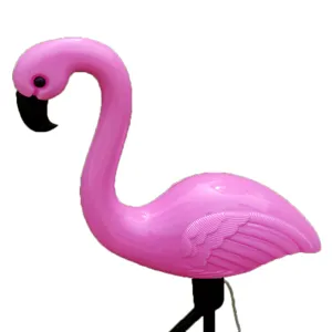 Detailed view of the vibrant pink flamingo solar garden light with textured wings and beak.