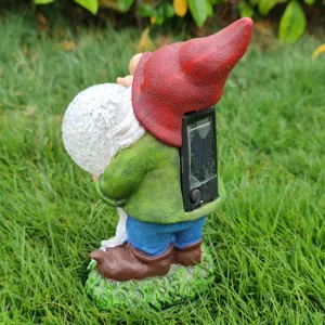 Solar garden gnome detail view, resin elf sculpture with crackle glass ball solar light.