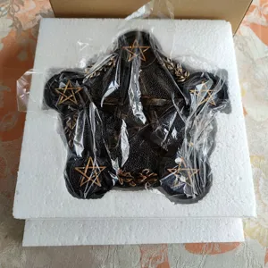 Close up of black resin pentagram candle holder detail, retro vintage altar decor tray.