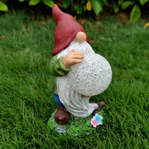 Solar garden gnome resin figurine with crackled glass ball light for outdoor yard decor view.
