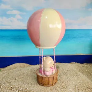 Mini hot air balloon bear figurine detail view, cute resin toy for sand play and decor.