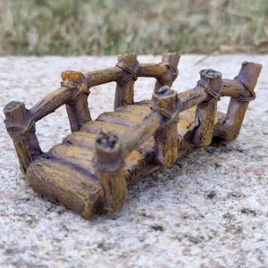 Close-up detail of the miniature resin wooden bridge ornament for sand tray decor.