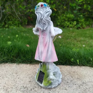 Detailed view of the resin solar garden fairy statue showing its solar panel and back craftsmanship.