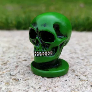 Green resin skull figurine, perfect for Halloween party decoration and psychological sandplay.