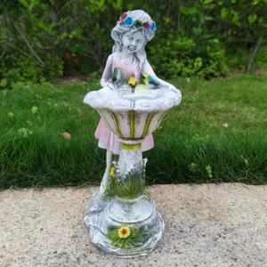 Resin fairy garden statue detail, cute angel sculpture with birds and flower bath for outdoor decor.