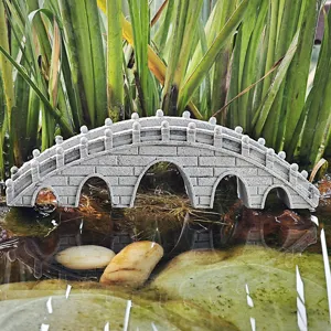 Miniature resin arch bridge aquarium decoration fish tank landscape ornament detail shot.