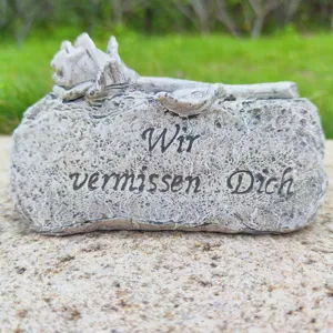 Memorial stone grave ornament with carved rose design and sympathy message for gardens.