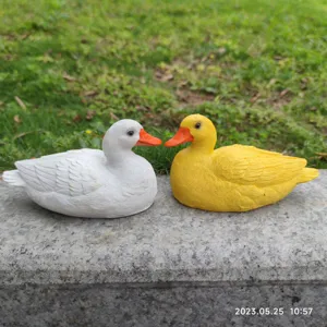 Resin cute white and yellow duck figurine detail, perfect for home garden tabletop decor.