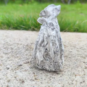 Resin memorial statue ornament graveyard Halloween decor stone texture detail closeup view