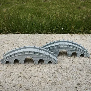 Detail view of miniature resin arch bridge ornaments for fish tank landscape and tea tray decor.