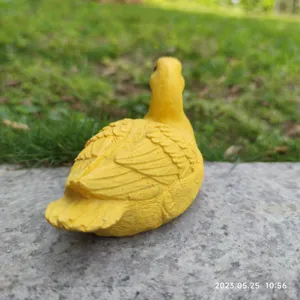 Detailed shot of cute yellow duck resin figurine sculpture for garden desktop ornament