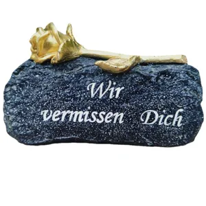 Memorial tombstone grave ornament with gold rose and German text for mourning loved ones.